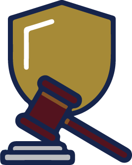 A gavel in front of a shield